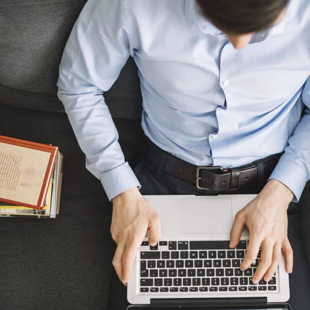from-man-using-laptop-sofa