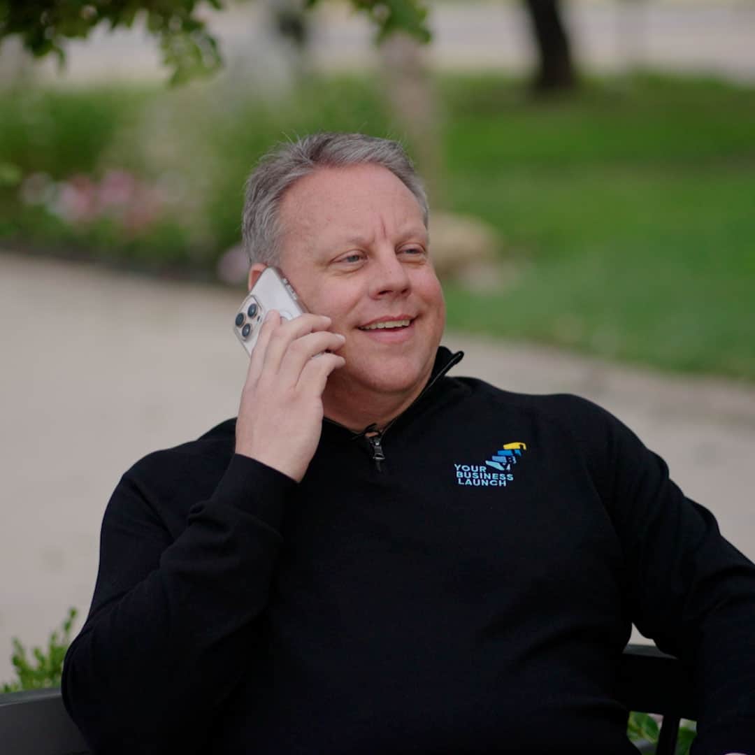 Matt Hanley talking on the phone outside